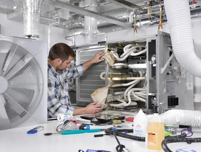 Warren Air Duct Cleaning specialist performing precision AC coil cleaning in Warren