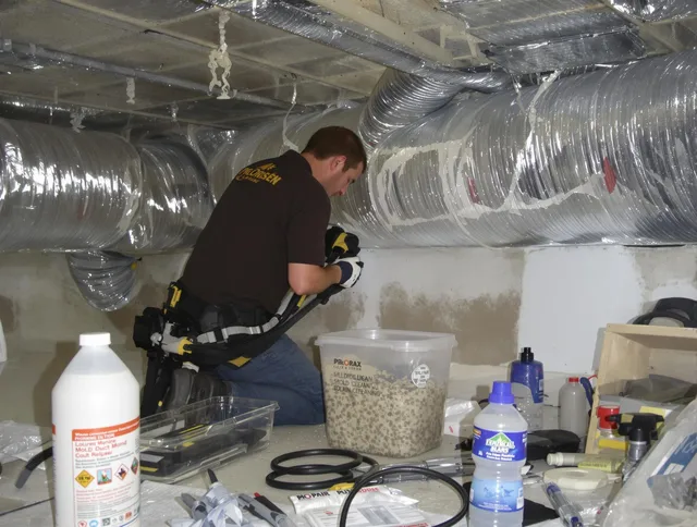 Warren Air Duct Cleaning specialist performing professional mold removal from air ducts in Warren