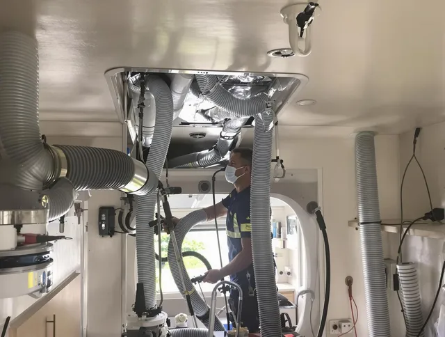 Warren Air Duct Cleaning specialist performing precise mobile home duct cleaning in Warren