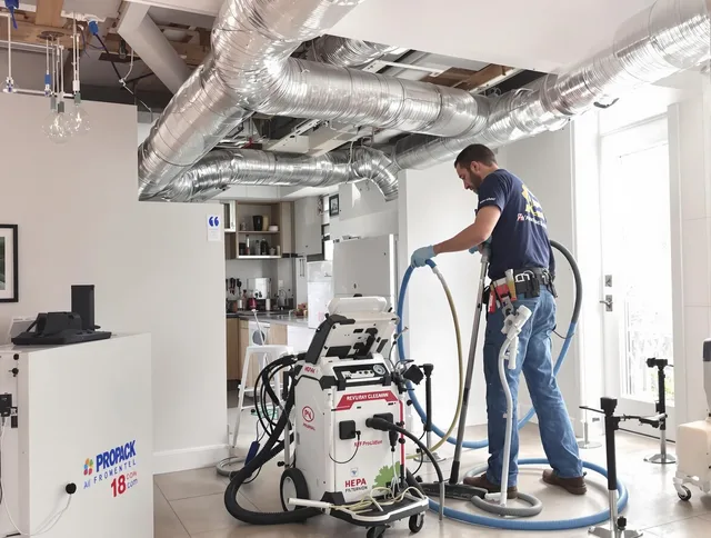 Warren Air Duct Cleaning technician performing advanced pure duct cleaning with specialized equipment in Warren