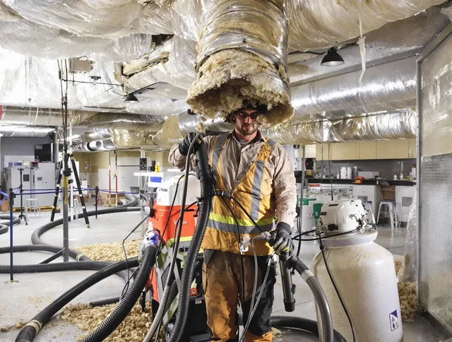 Professional vacuum insulation removal by Warren Air Duct Cleaning expert in Warren